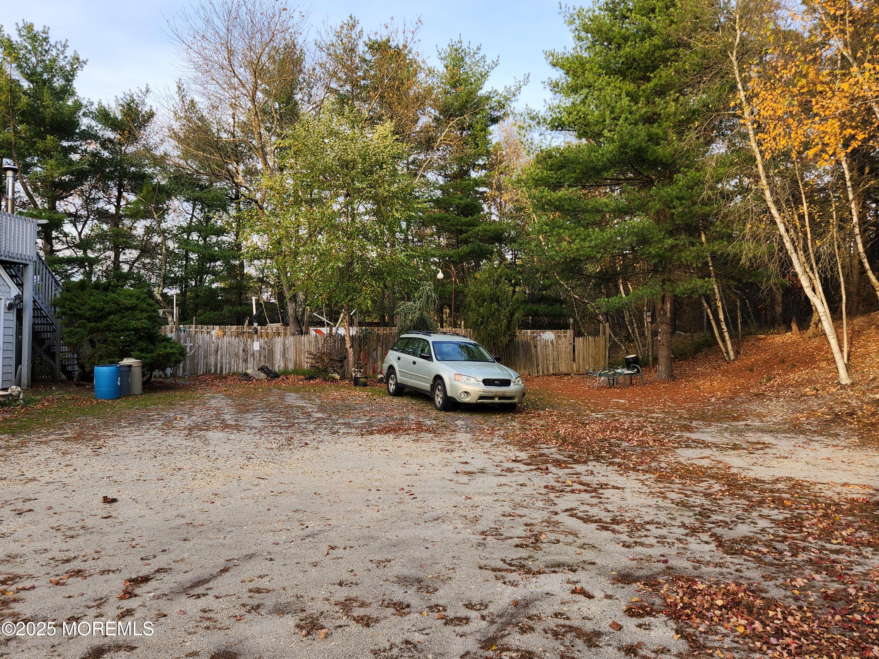 860 Highway 72 Barnegat, NJ 08005 - Photo 3 of 9 a view of a backyard with parked car