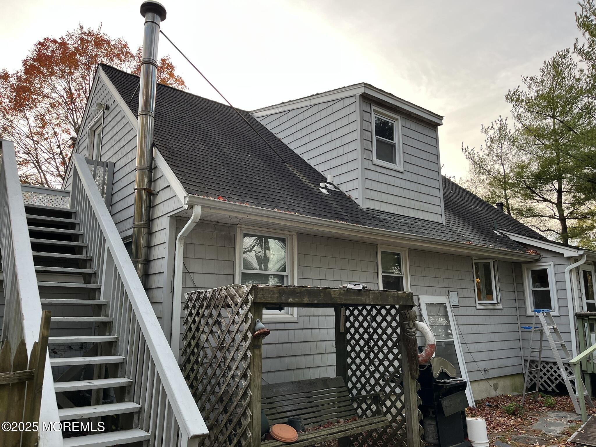 860 Highway 72 Barnegat, NJ 08005 - Photo 4 of 9 a front view of a house with wooden stairs