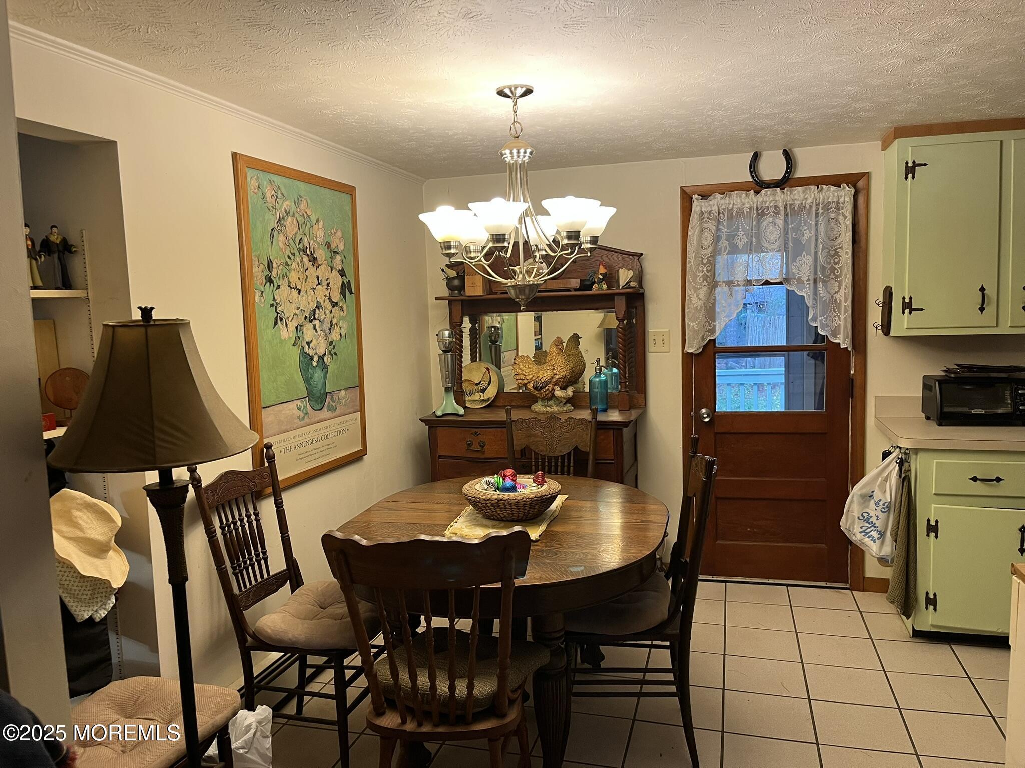 860 Highway 72 Barnegat, NJ 08005 - Photo 7 of 9 a view of a dining room with furniture and chandelier