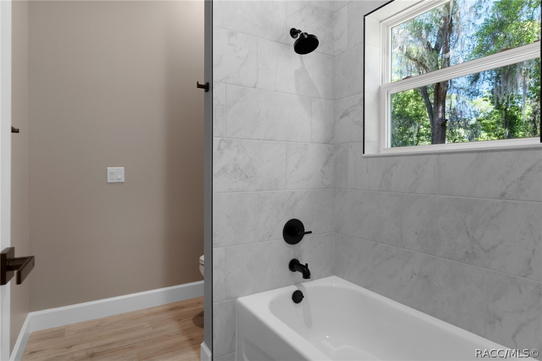 4530 South Florida Avenue Inverness, FL 34450 - Photo 36 of 100 a bathroom with a tub and a window