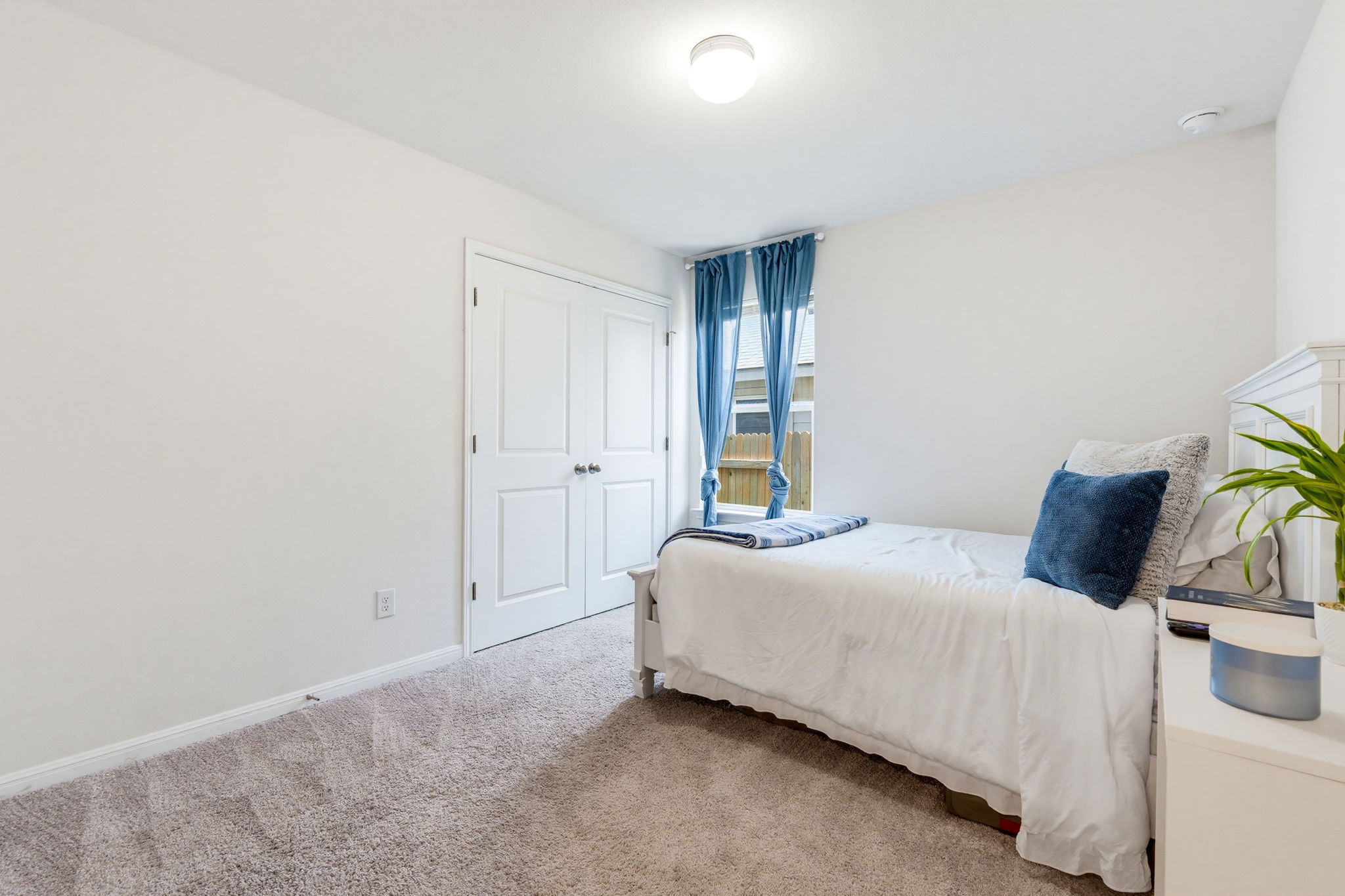 316 Windstar Road Liberty Hill, TX 78642 - Photo 23 of 27 a bedroom with a bed and a window