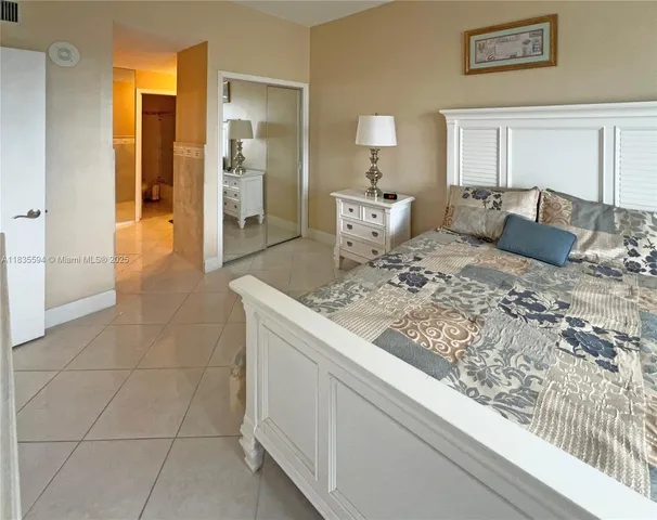 a living room with a bed and furniture