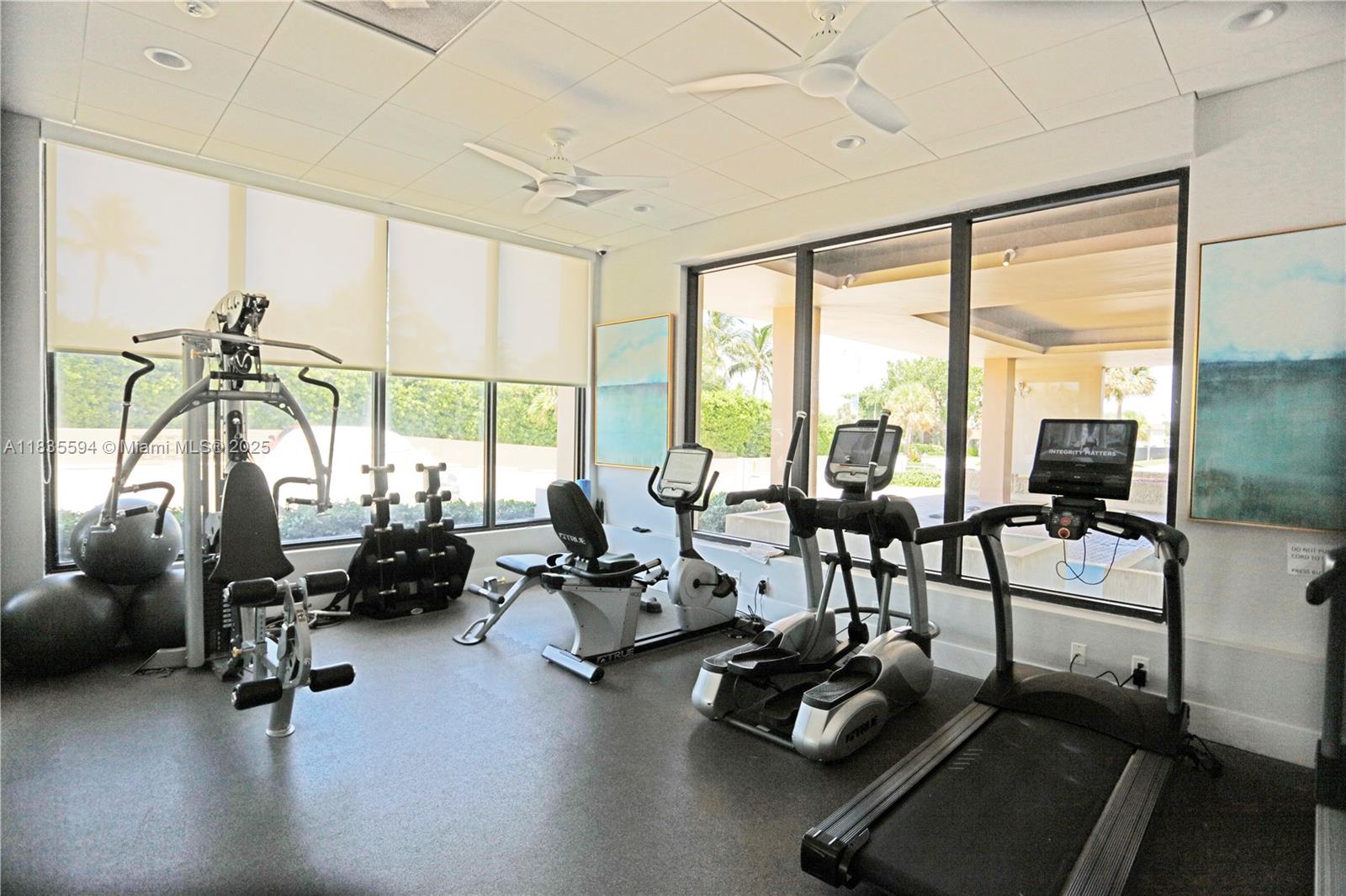 2000 South Ocean Boulevard, Unit 16P Lauderdale-by-the-Sea, FL 33062 - Photo 16 of 31 a living room with furniture floor to ceiling window and a flat screen tv