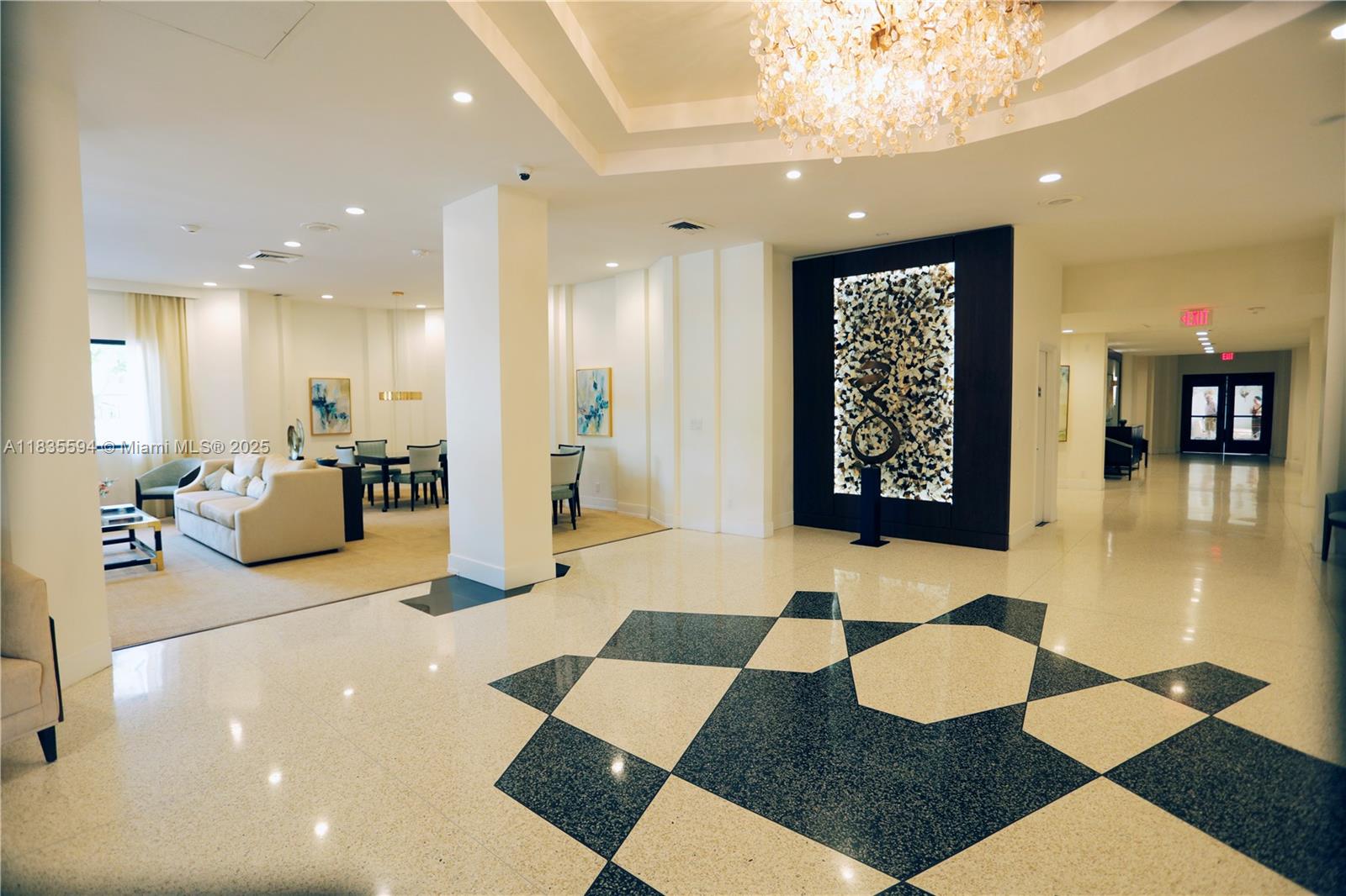 2000 South Ocean Boulevard, Unit 16P Lauderdale-by-the-Sea, FL 33062 - Photo 17 of 31 a lobby with a rug and glass door