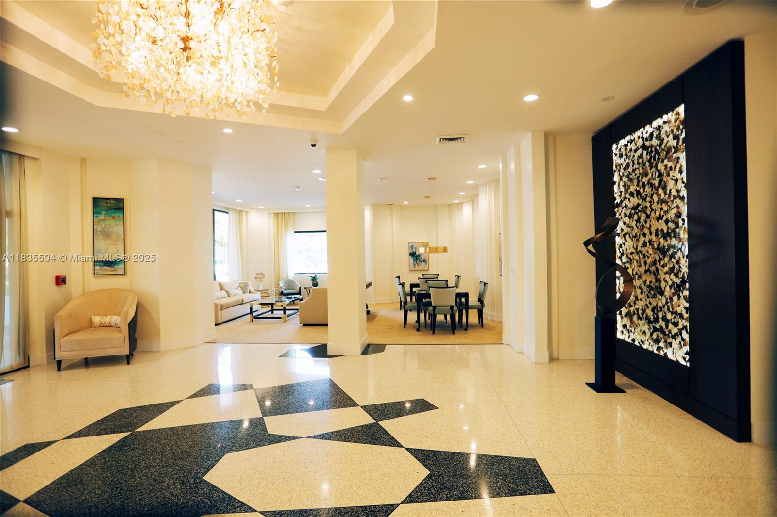 2000 South Ocean Boulevard, Unit 16P Lauderdale-by-the-Sea, FL 33062 - Photo 18 of 31 a lobby with furniture and a chandelier