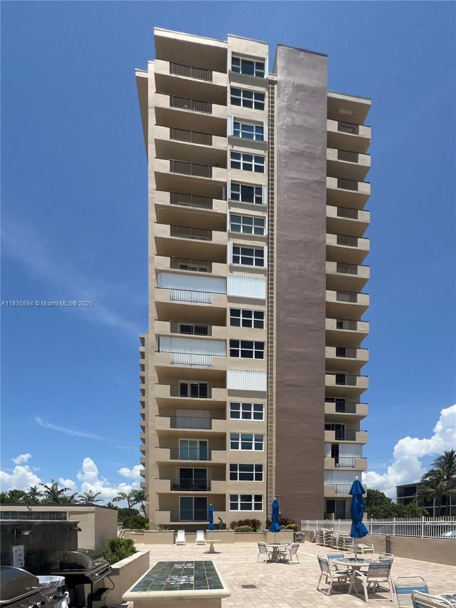 2000 South Ocean Boulevard, Unit 16P Lauderdale-by-the-Sea, FL 33062 - Photo 23 of 31 a front view of a building with streets and trees