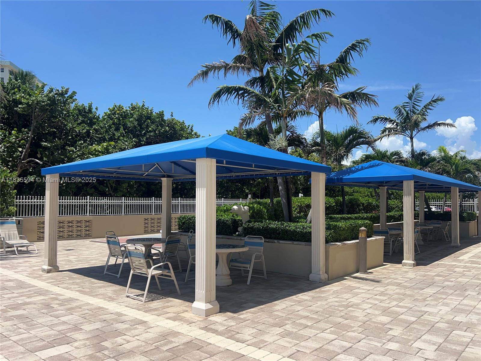 2000 South Ocean Boulevard, Unit 16P Lauderdale-by-the-Sea, FL 33062 - Photo 26 of 31 a patio with table and chairs