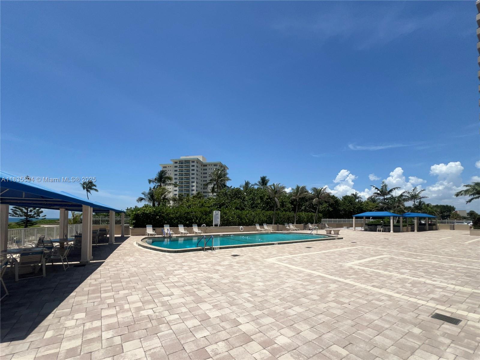 2000 South Ocean Boulevard, Unit 16P Lauderdale-by-the-Sea, FL 33062 - Photo 29 of 31 a view of swimming pool with outdoor seating