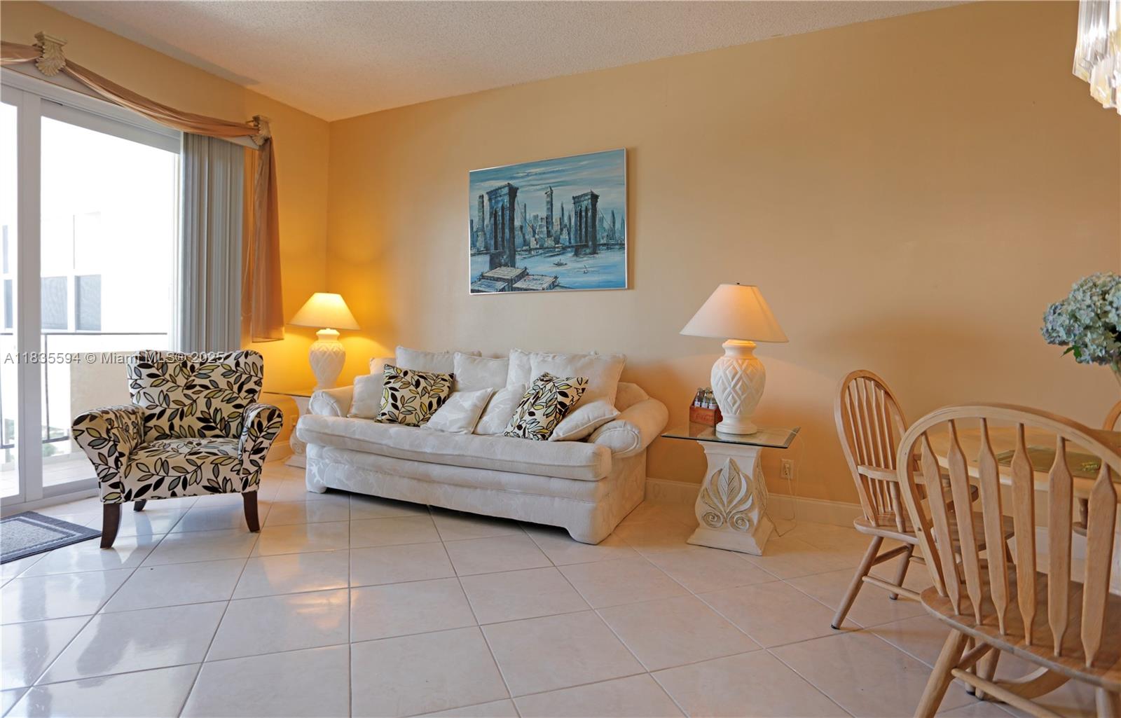 2000 South Ocean Boulevard, Unit 16P Lauderdale-by-the-Sea, FL 33062 - Photo 3 of 31 a living room with furniture and a large window