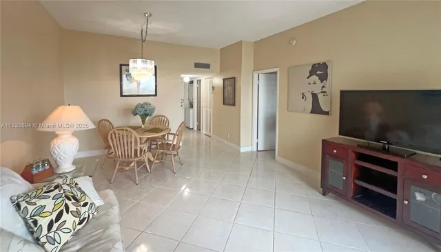 a view of a livingroom with furniture and a flat screen tv