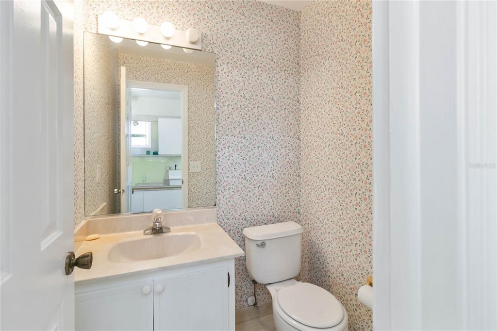 924 Wald Road Orlando, FL 32806 - Photo 25 of 66 a bathroom with a toilet sink and mirror