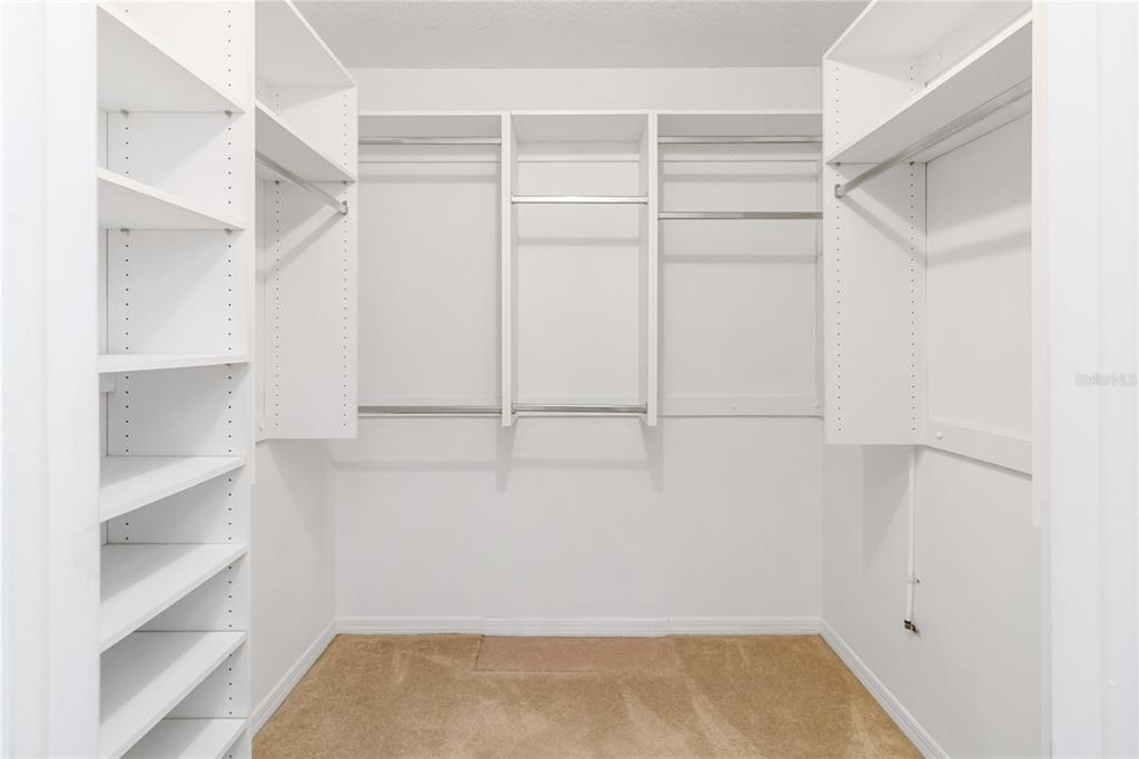 924 Wald Road Orlando, FL 32806 - Photo 30 of 66 a view of walk in closet with empty racks