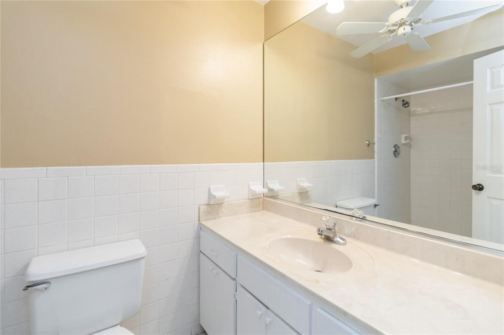 924 Wald Road Orlando, FL 32806 - Photo 31 of 66 a bathroom with a sink and a mirror