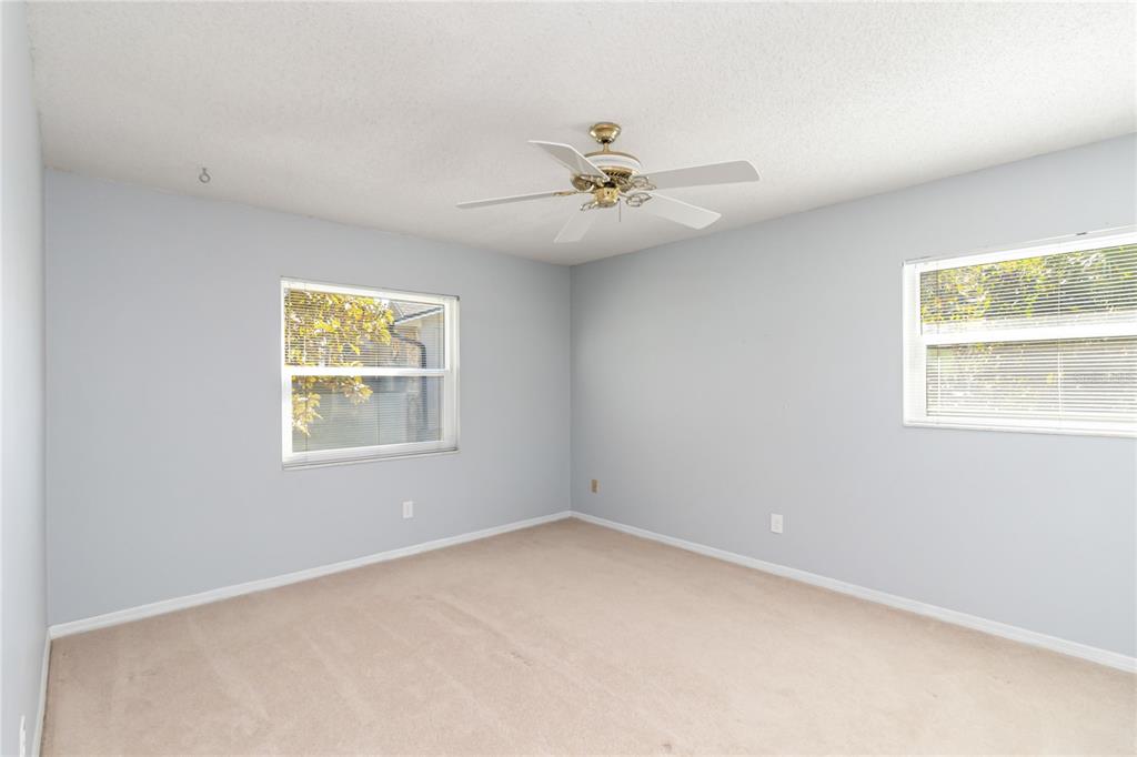 924 Wald Road Orlando, FL 32806 - Photo 39 of 66 an empty room with a window and a fan