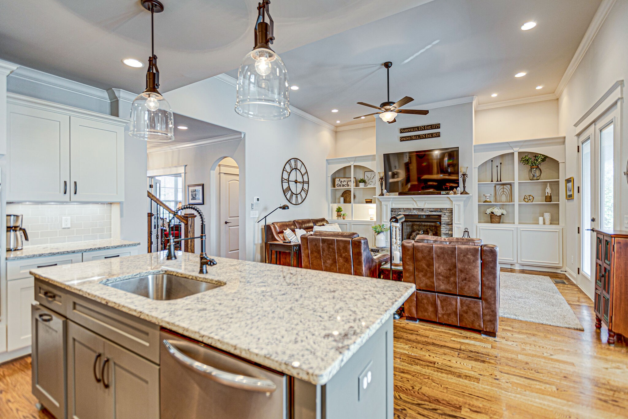 6005 Canberra Court Spring Hill, TN 37174 - Photo 12 of 55 a kitchen with stainless steel appliances granite countertop a sink dishwasher a oven and a dining table with kitchen island