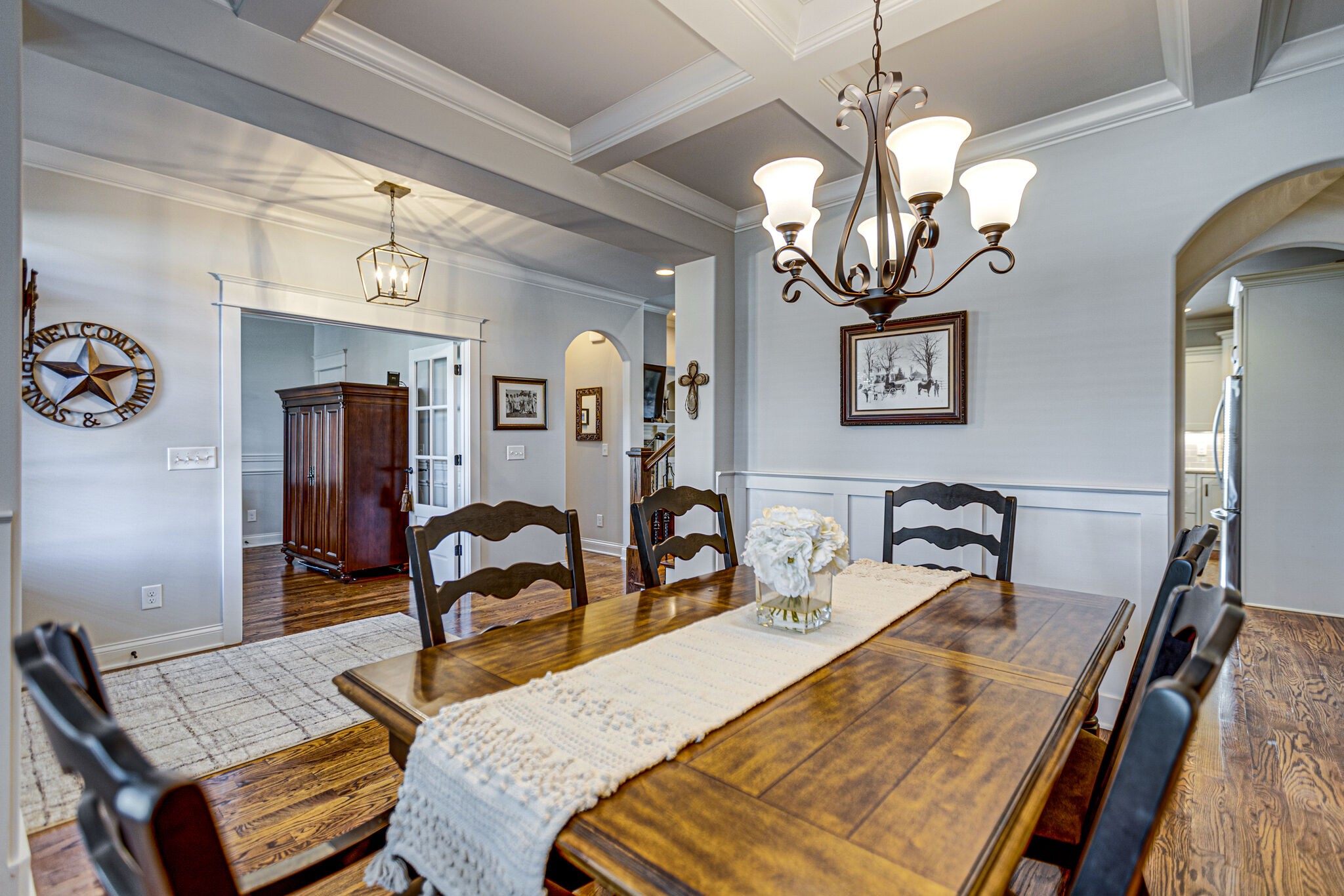 6005 Canberra Court Spring Hill, TN 37174 - Photo 16 of 55 a bedroom with bed and a chandelier