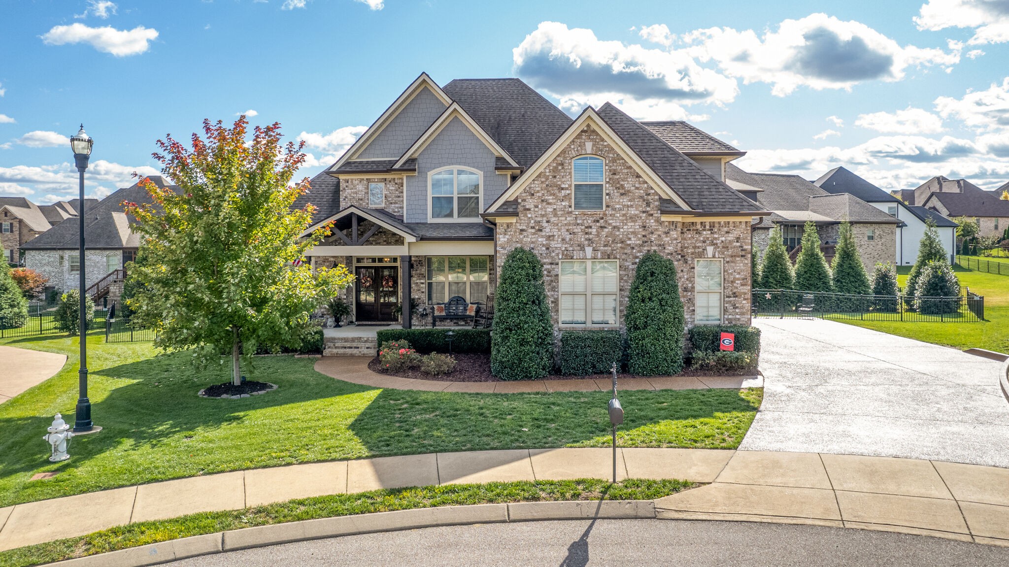 6005 Canberra Court Spring Hill, TN 37174 - Photo 2 of 55 a front view of a house with a yard