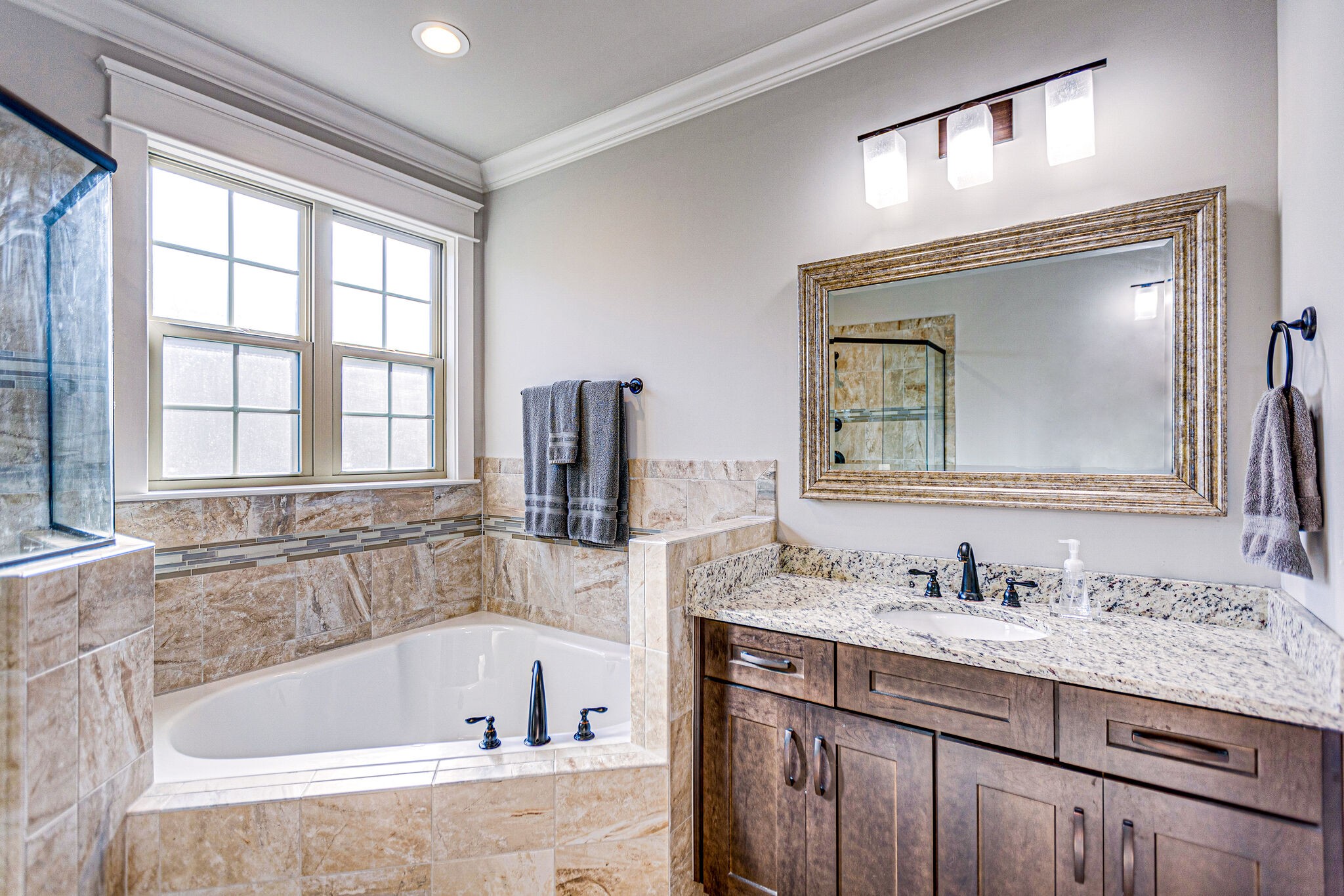 6005 Canberra Court Spring Hill, TN 37174 - Photo 26 of 55 a bathroom with a granite countertop tub sink and mirror