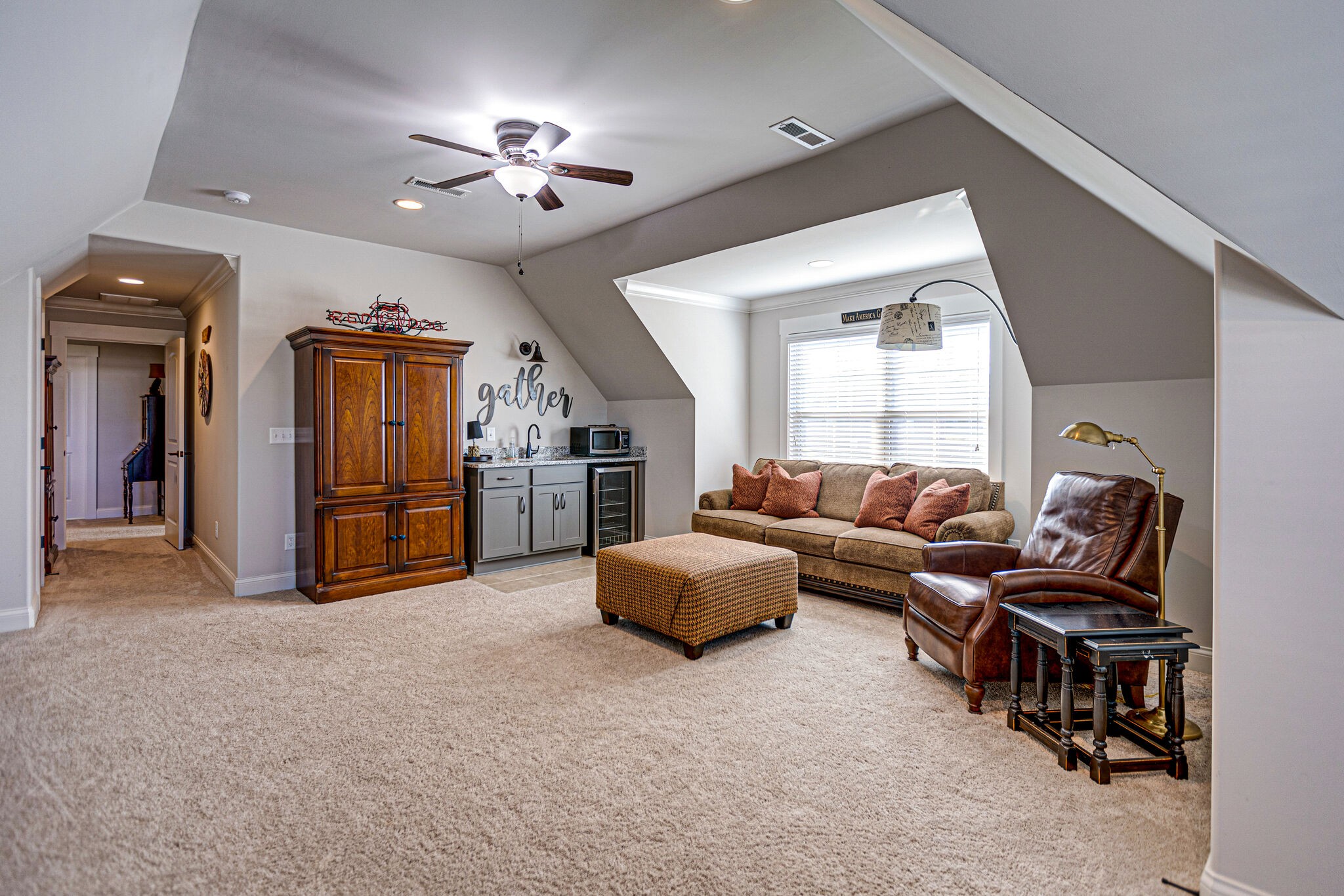 6005 Canberra Court Spring Hill, TN 37174 - Photo 30 of 55 a living room with furniture and a chandelier