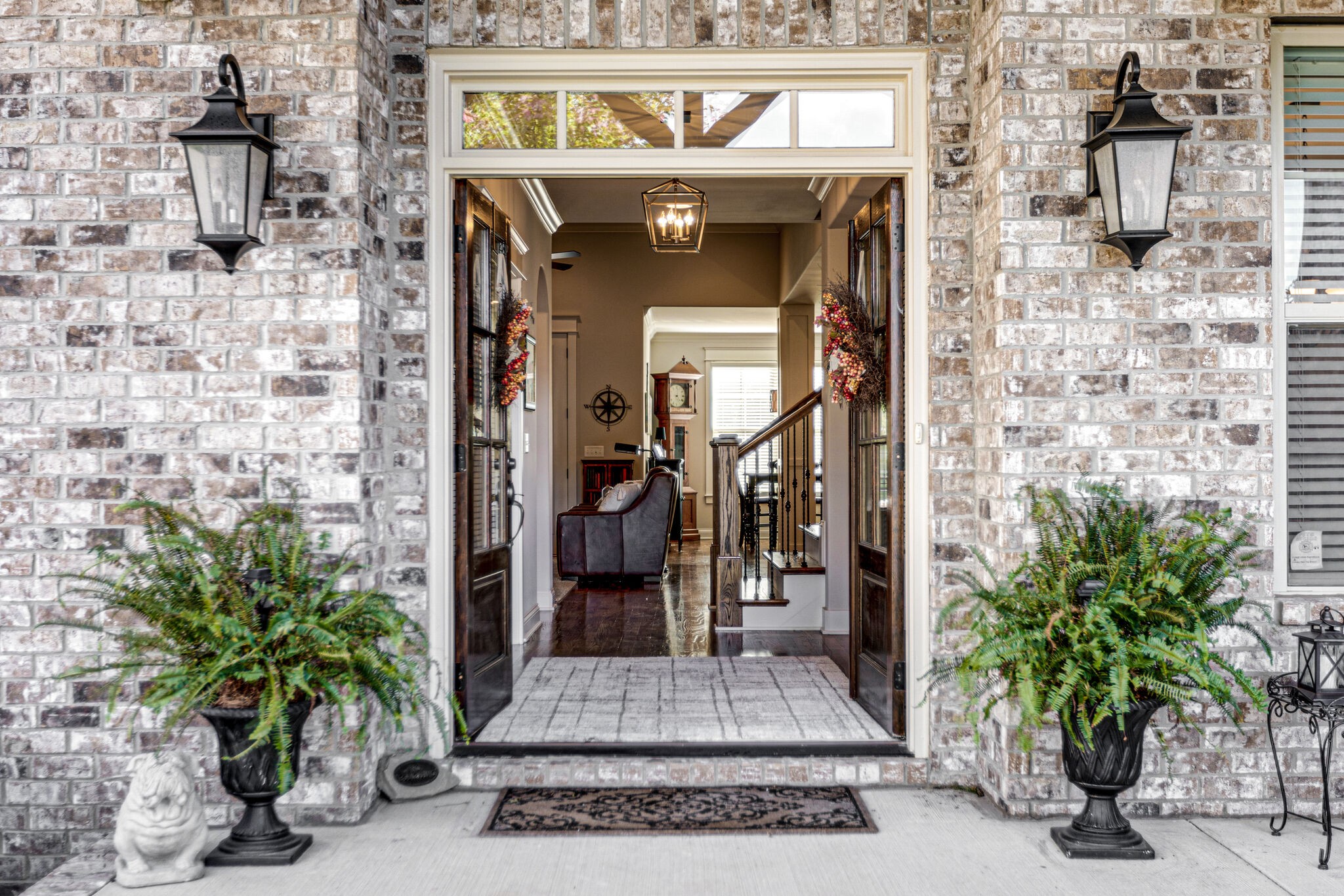 6005 Canberra Court Spring Hill, TN 37174 - Photo 3 of 55 a front view of a building with potted plants