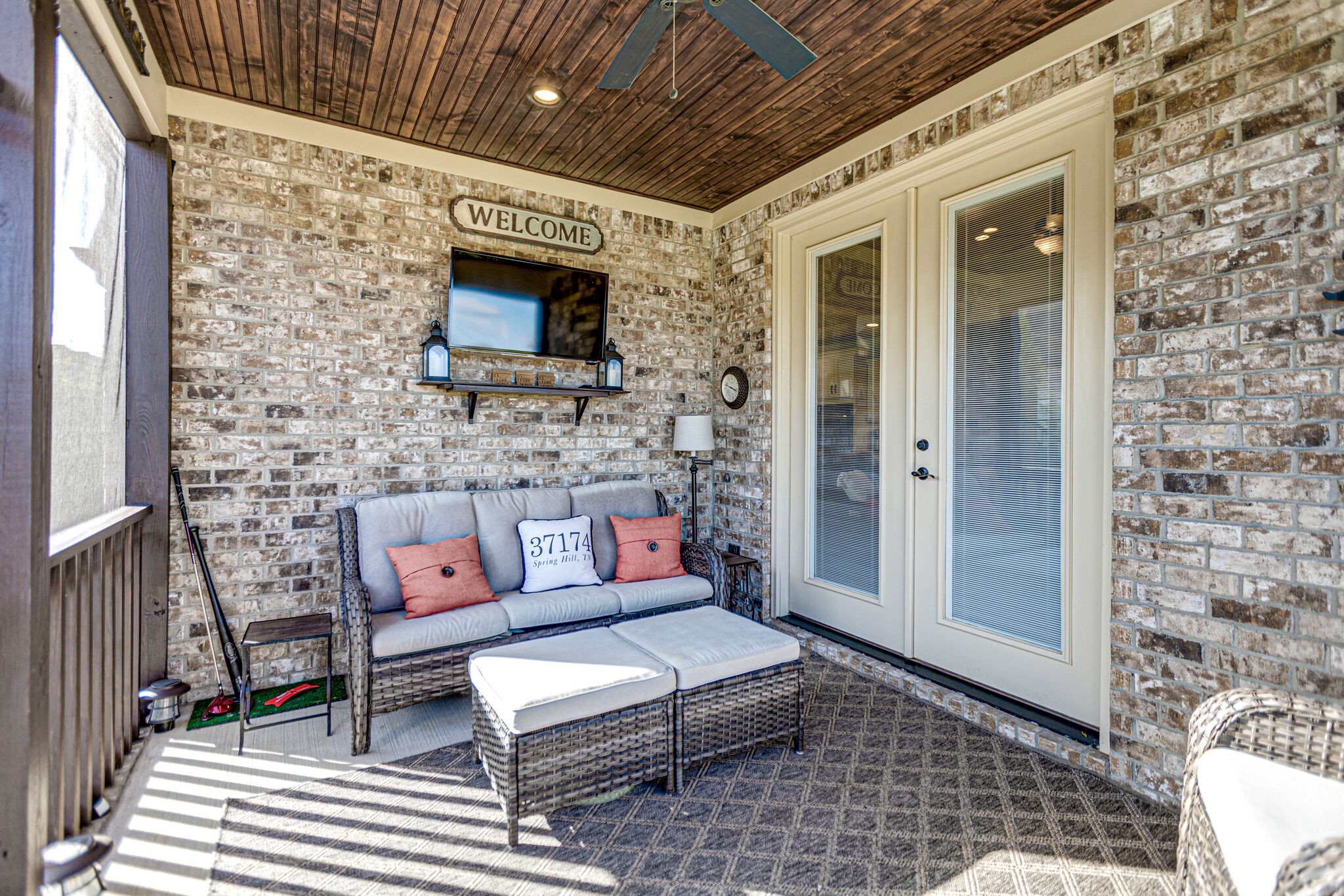 6005 Canberra Court Spring Hill, TN 37174 - Photo 40 of 55 a outdoor living space with a couch and a fireplace