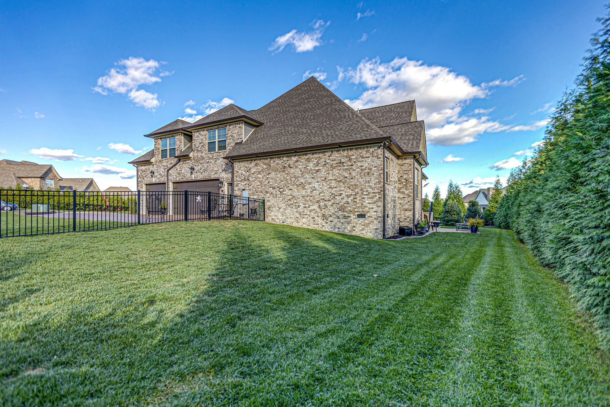 6005 Canberra Court Spring Hill, TN 37174 - Photo 42 of 55 a view of a house with a big yard and large trees