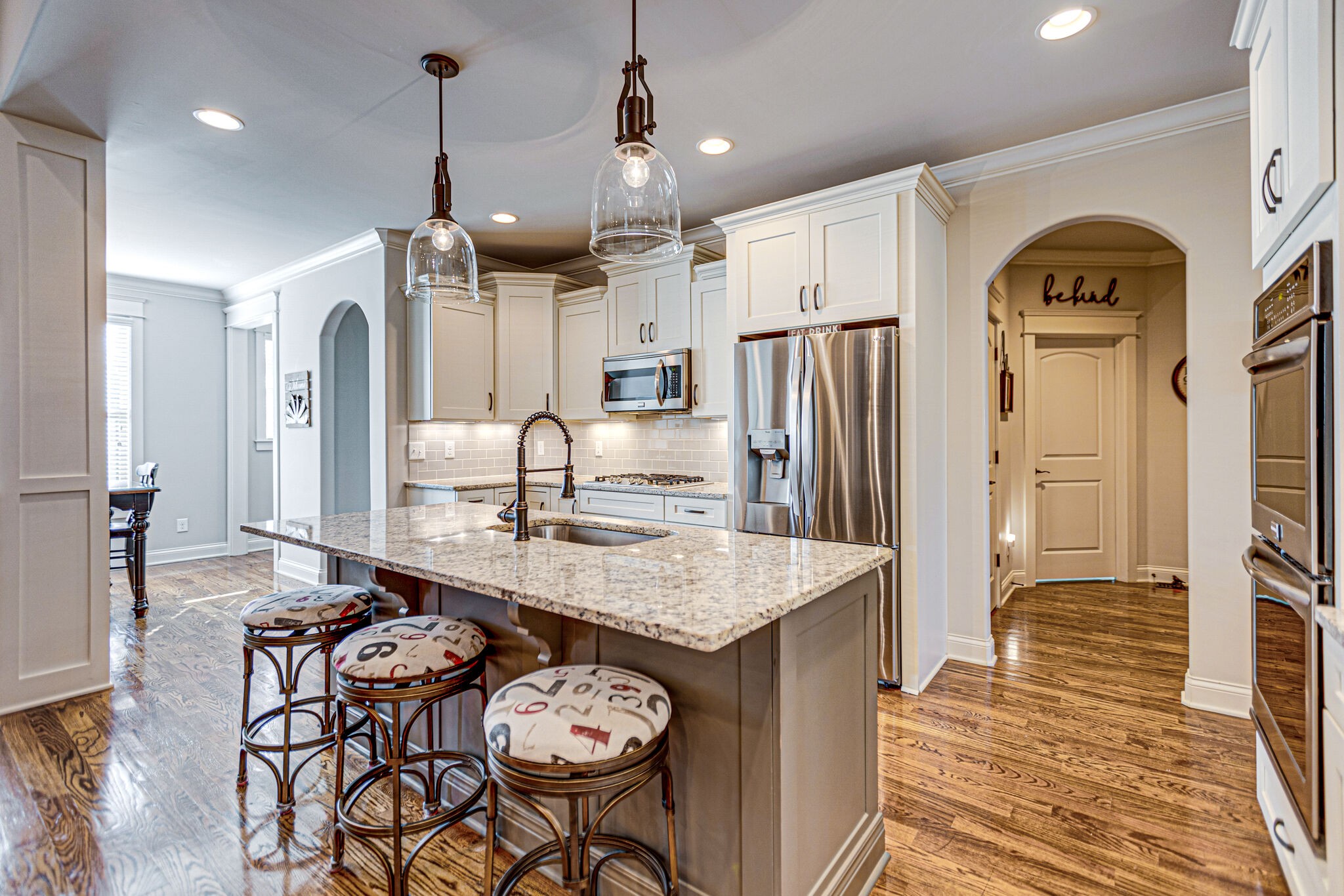 6005 Canberra Court Spring Hill, TN 37174 - Photo 10 of 55 a large kitchen with granite countertop a sink stainless steel appliances and cabinets