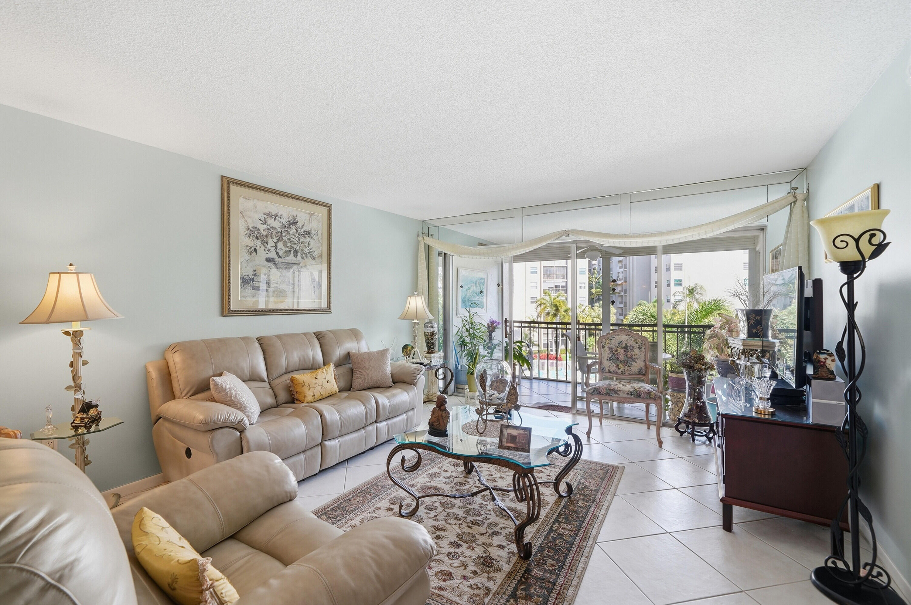 3920 Inverrary Boulevard, Unit 403C Lauderhill, FL 33319 - Photo 11 of 29 a living room with furniture and a large window
