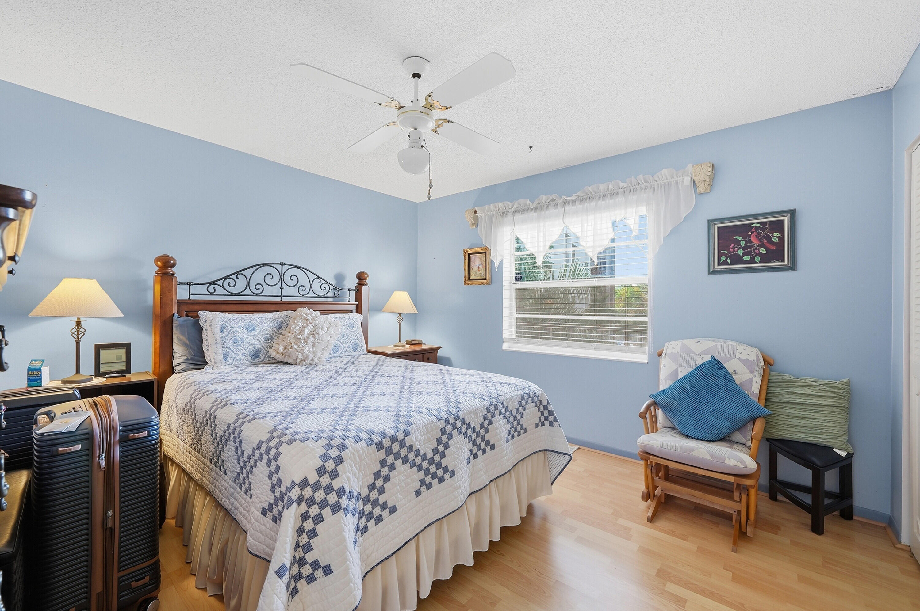 3920 Inverrary Boulevard, Unit 403C Lauderhill, FL 33319 - Photo 15 of 29 a bedroom with a bed and a window