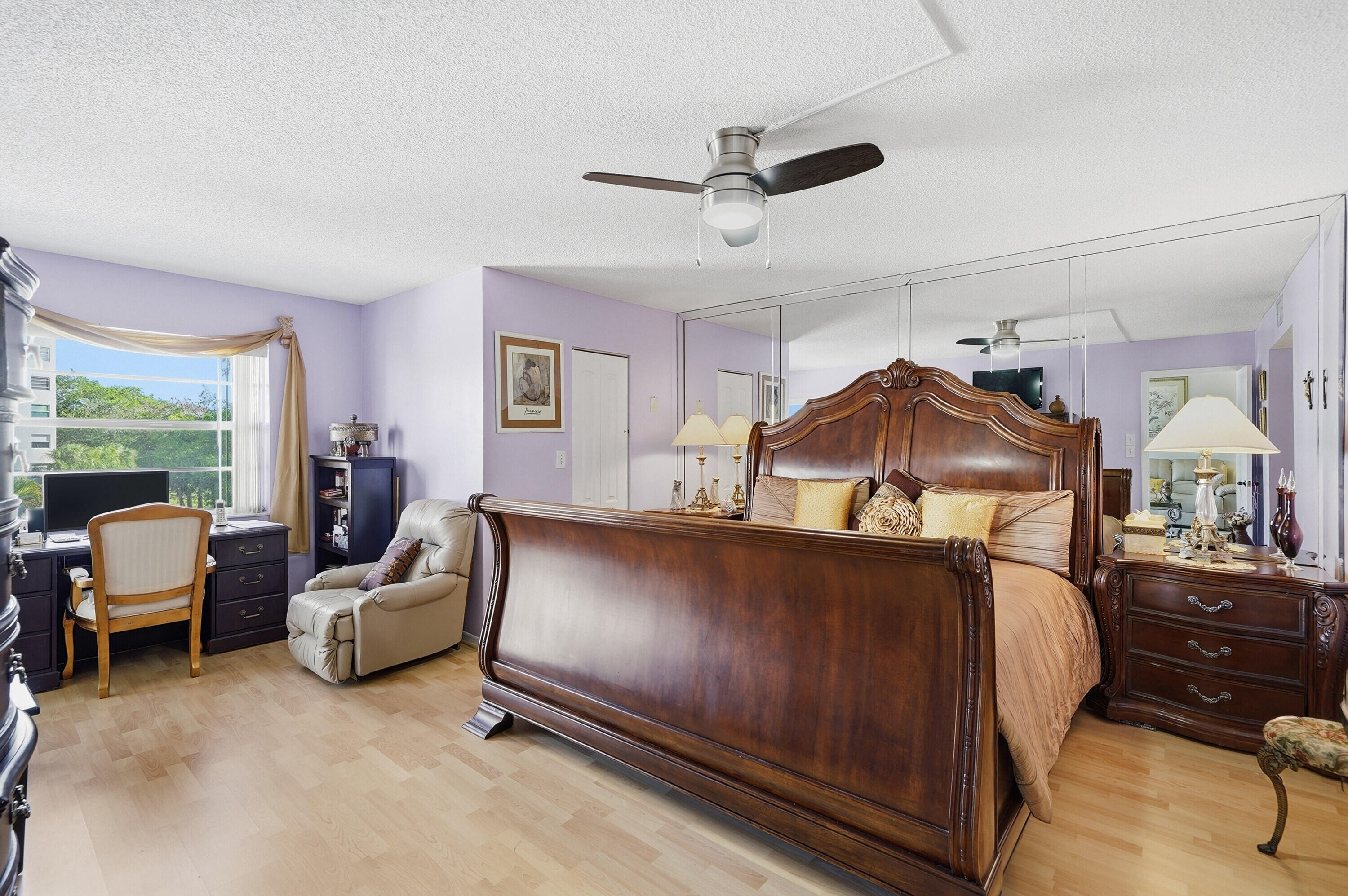 3920 Inverrary Boulevard, Unit 403C Lauderhill, FL 33319 - Photo 18 of 29 a bedroom with furniture and a window