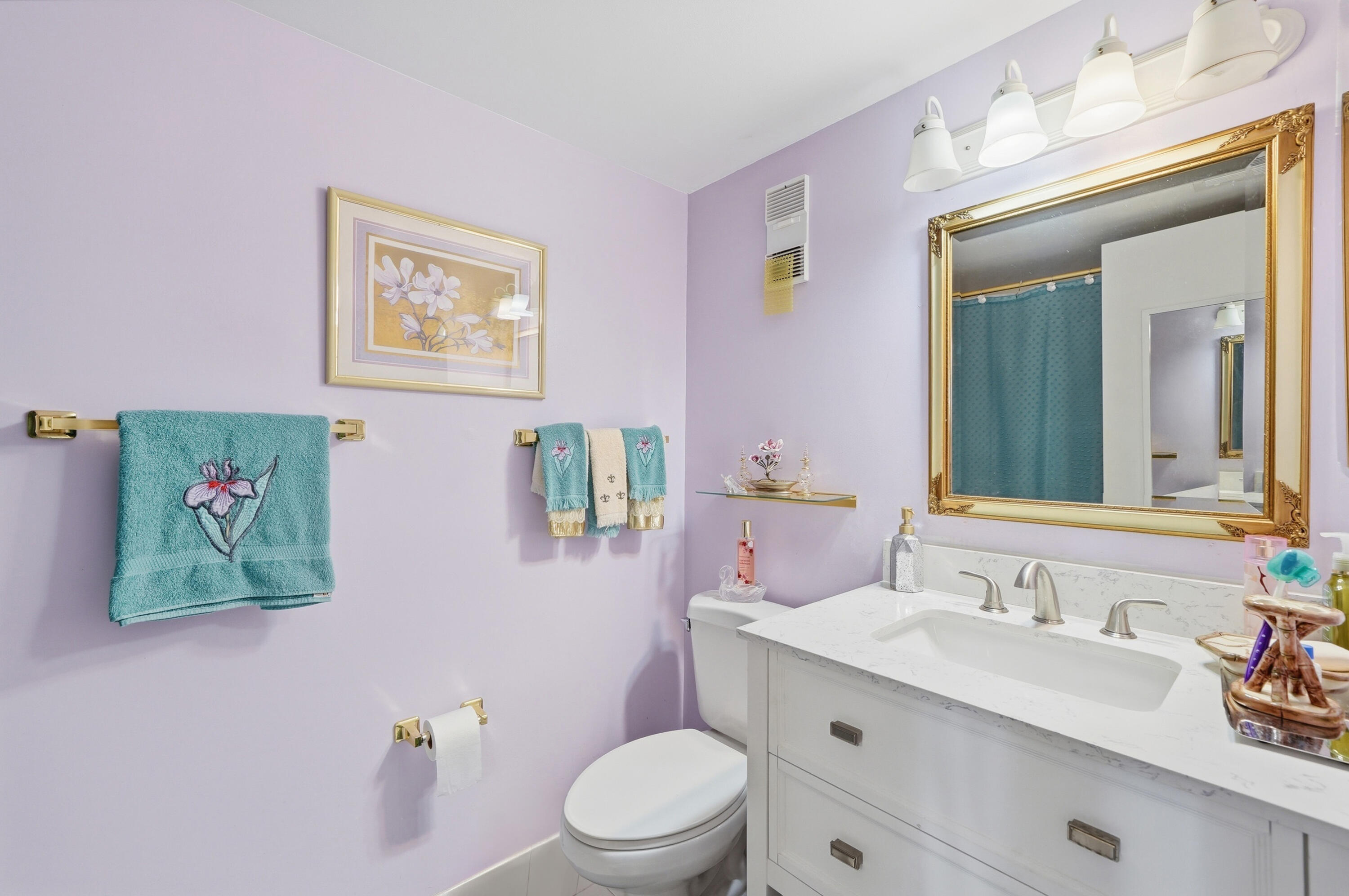 3920 Inverrary Boulevard, Unit 403C Lauderhill, FL 33319 - Photo 23 of 29 a bathroom with a granite countertop sink mirror vanity and toilet