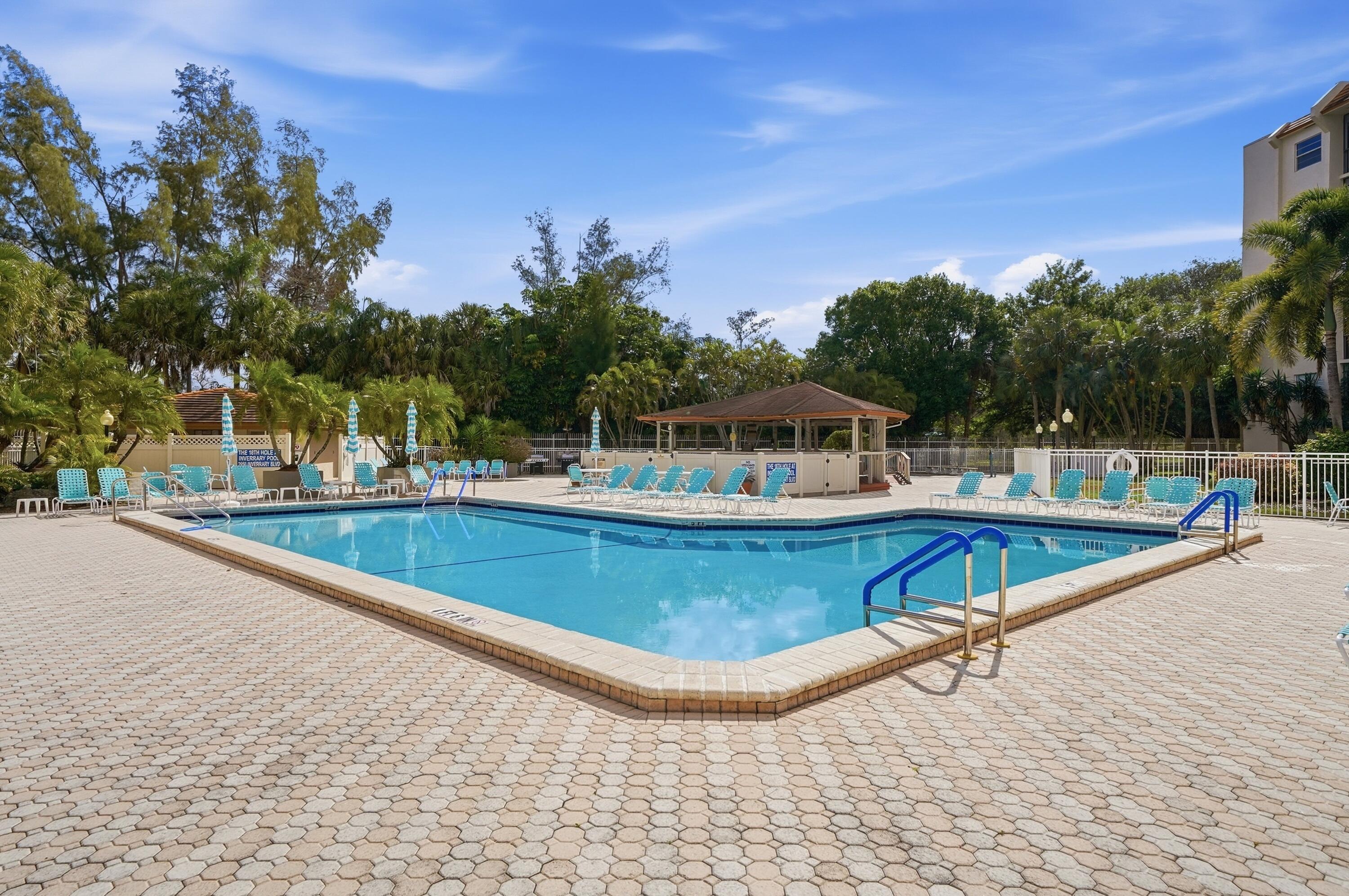 3920 Inverrary Boulevard, Unit 403C Lauderhill, FL 33319 - Photo 29 of 29 a view of swimming pool with outdoor seating and yard in the back