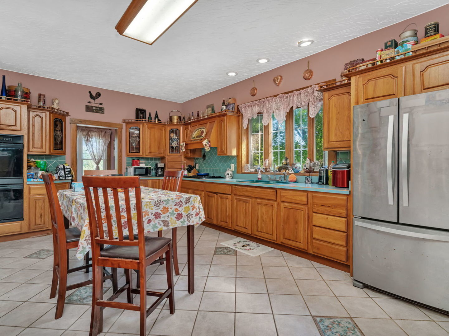 7140 East Huston Road Braceville, IL 60407 - Photo 11 of 34 a kitchen with stainless steel appliances granite countertop a refrigerator and a sink