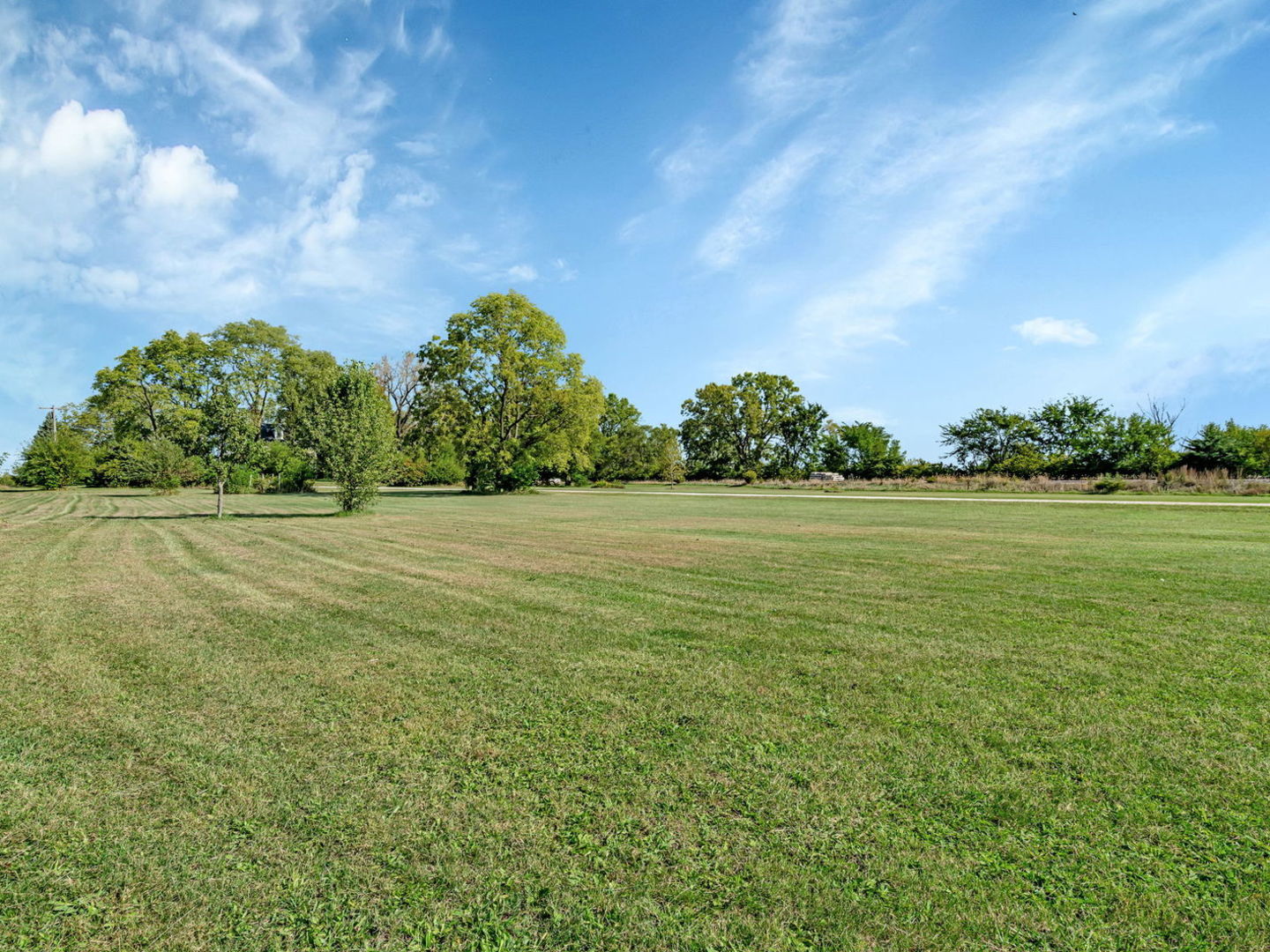7140 East Huston Road Braceville, IL 60407 - Photo 31 of 34 a view of a field with an trees in the background