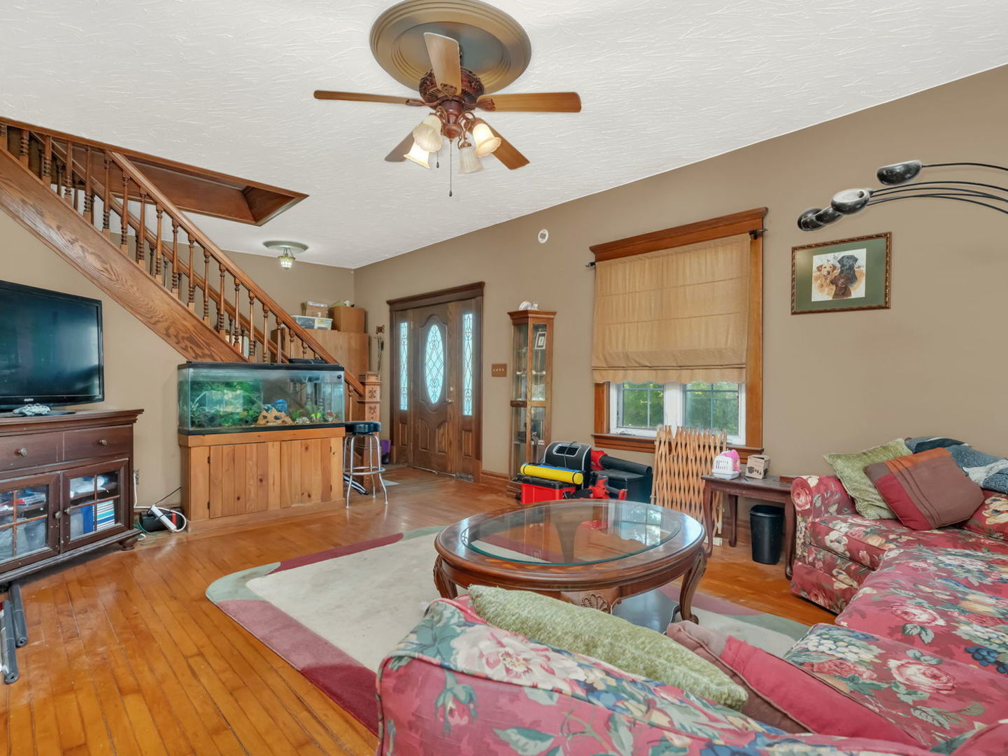 7140 East Huston Road Braceville, IL 60407 - Photo 6 of 34 a living room with furniture and a flat screen tv