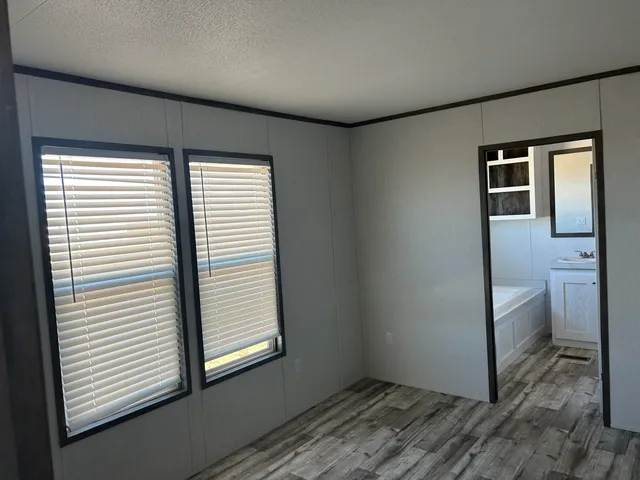 a bathroom with a sink toilet and mirror