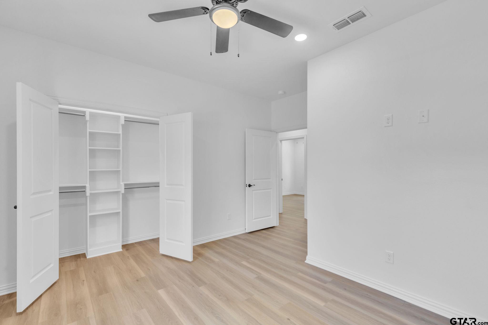 1410 West Connally Street Tyler, TX 75701 - Photo 14 of 29 wooden floor in an empty room with a window
