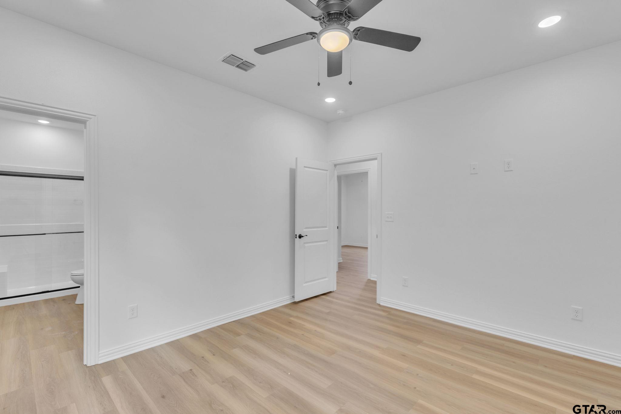 1410 West Connally Street Tyler, TX 75701 - Photo 19 of 29 wooden floor in an empty room