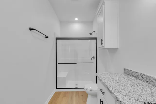 a kitchen with a refrigerator and countertop