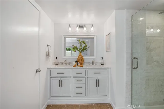a bathroom with a bathtub a sink and a shower
