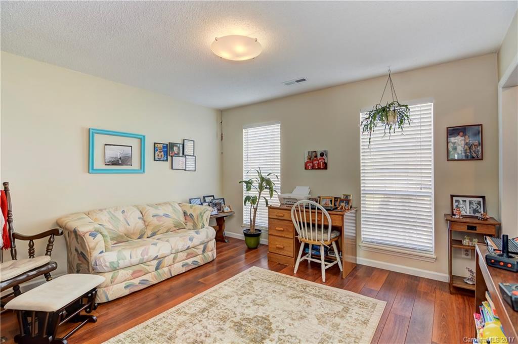 2206 Killarney Place Charlotte, NC 28262 - Photo 13 of 23 a living room with furniture and wooden floor