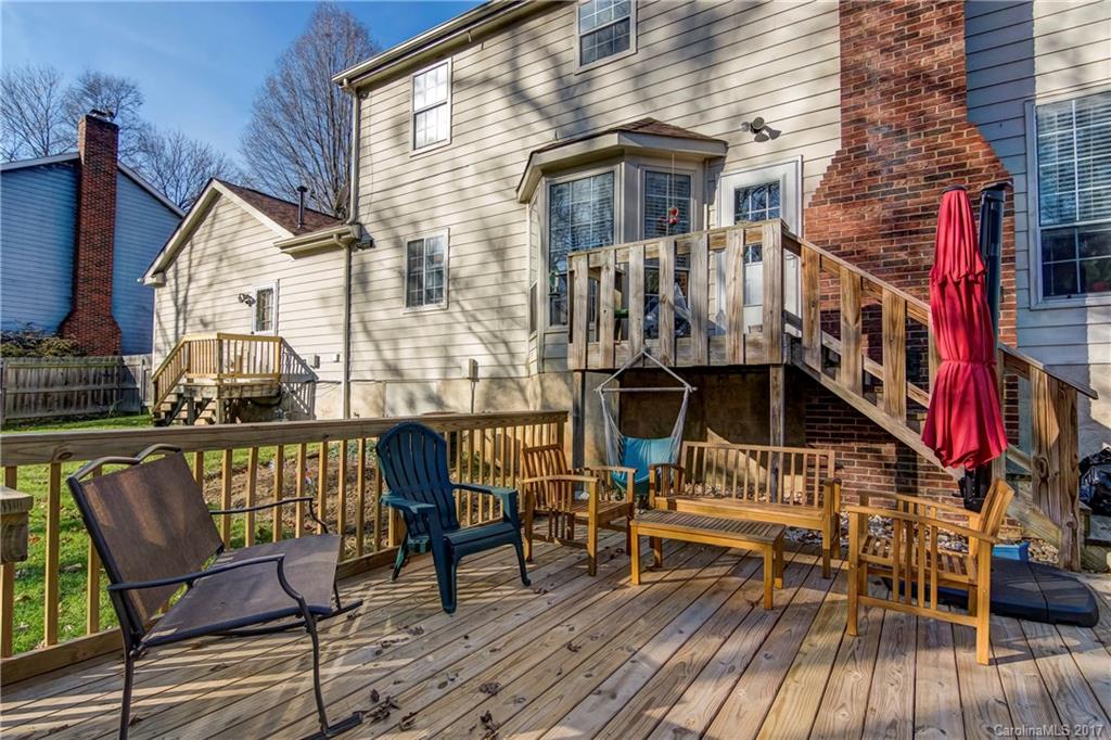 2206 Killarney Place Charlotte, NC 28262 - Photo 21 of 23 a view of sitting area on deck with wooden floor and seating space