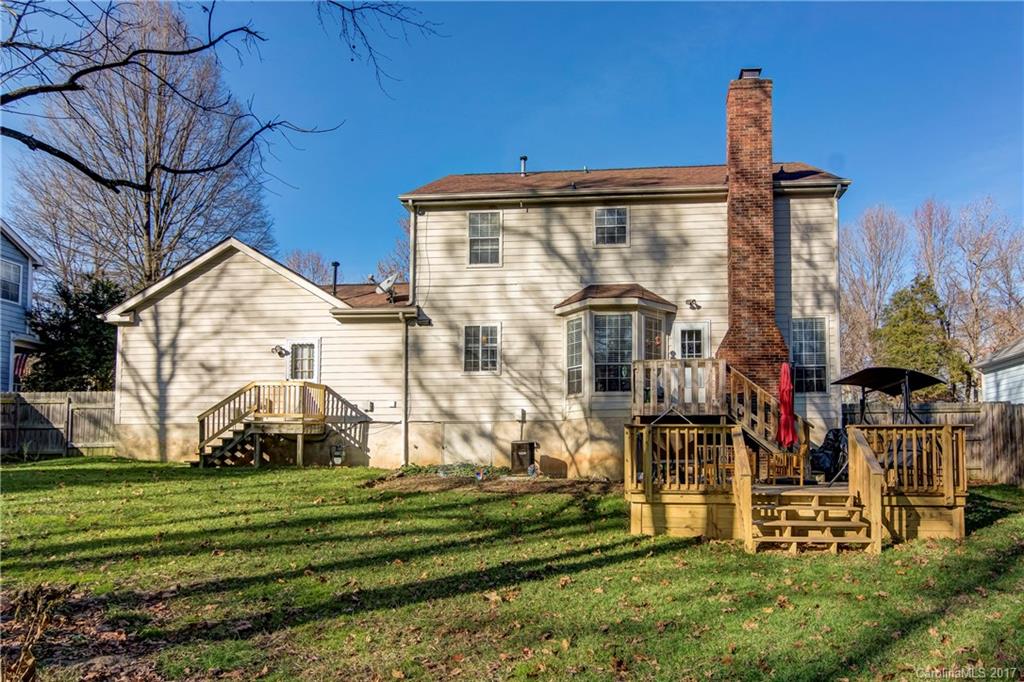 2206 Killarney Place Charlotte, NC 28262 - Photo 22 of 23 a front view of a house with a yard