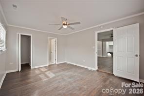 1404 Nottingham Road Kannapolis, NC 28081 - Photo 15 of 30 a view of an empty room with closet and wooden floor