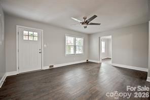 1404 Nottingham Road Kannapolis, NC 28081 - Photo 18 of 30 a view of empty room with wooden floor and fan