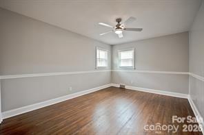 1404 Nottingham Road Kannapolis, NC 28081 - Photo 20 of 30 an empty room with wooden floor fan and windows