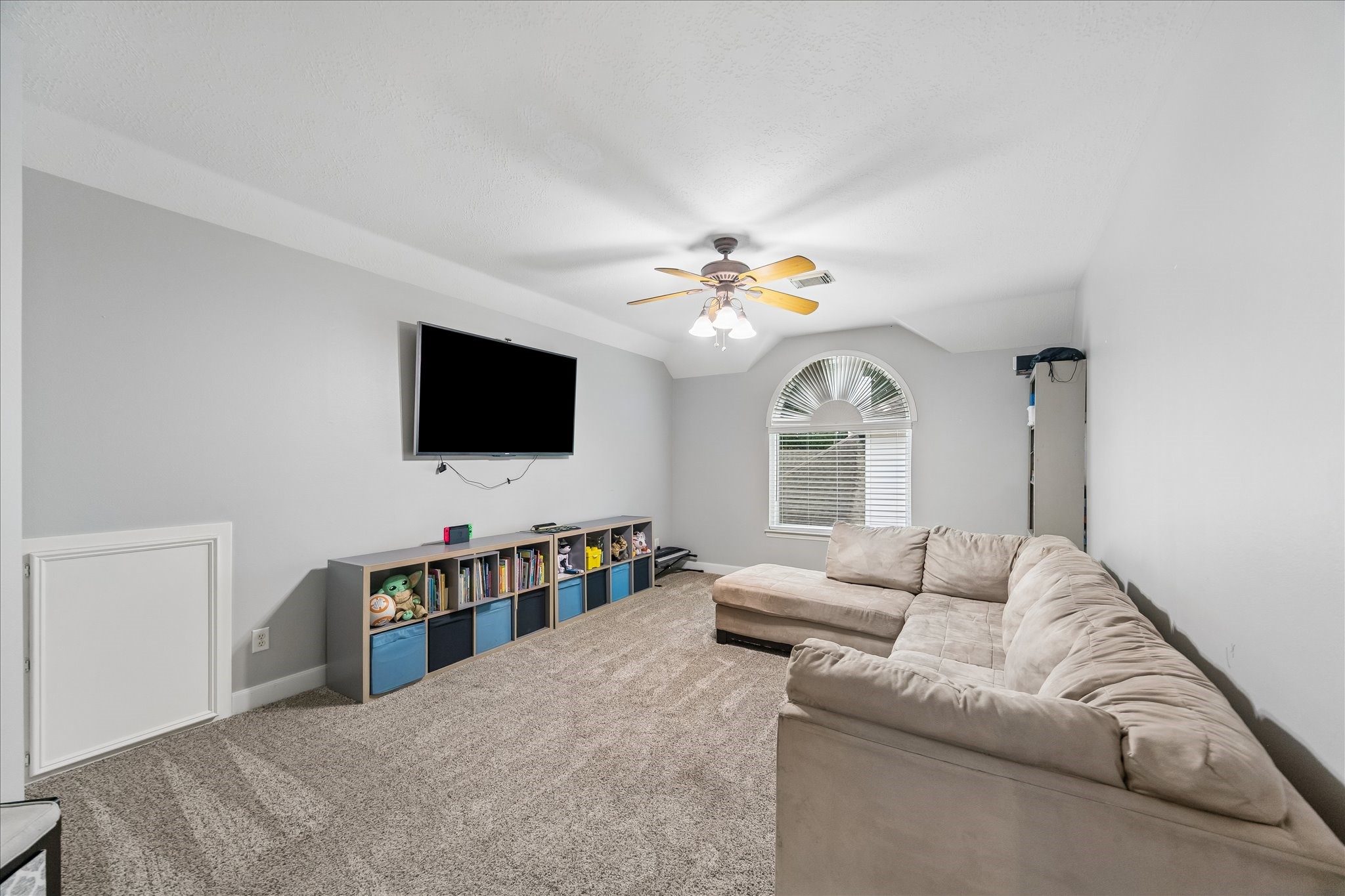 23039 Enchanted Landing Lane Katy, TX 77494 - Photo 22 of 30 a living room with furniture and a flat screen tv