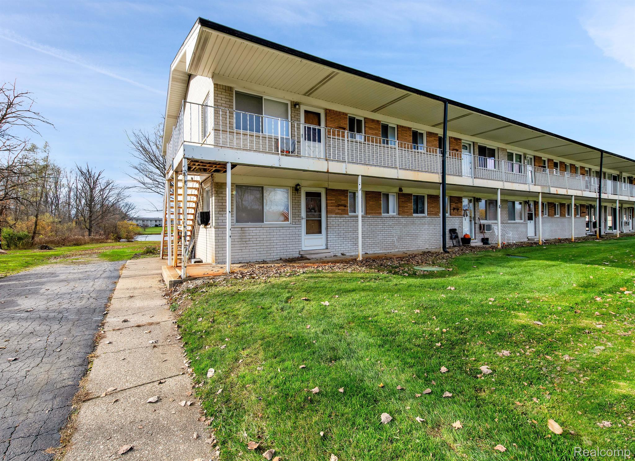 26945 Milford Road, Unit 2 New Hudson, MI 48165 - Photo 1 of 29 Upper end unit with additional windows.