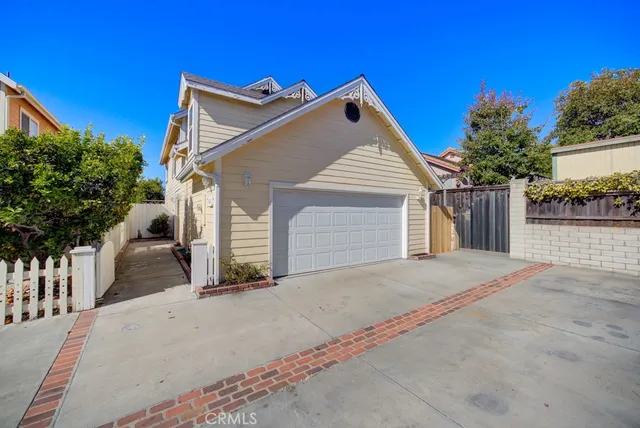 a view of a house with a yard and garage
