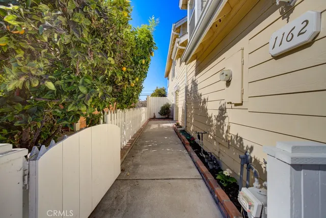 a view of a pathway both side of house